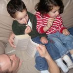 Kids sitting on daddy