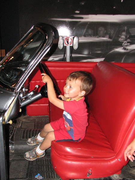 Anderson-driving a car in Gasoline Alley at Heritage Park