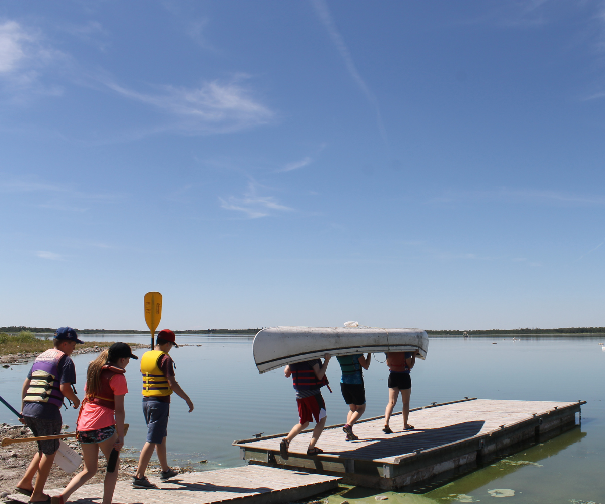 Kids Carrying a Kayak and Paddles - Hastings Bible Camp (Family Fun Edmonton)