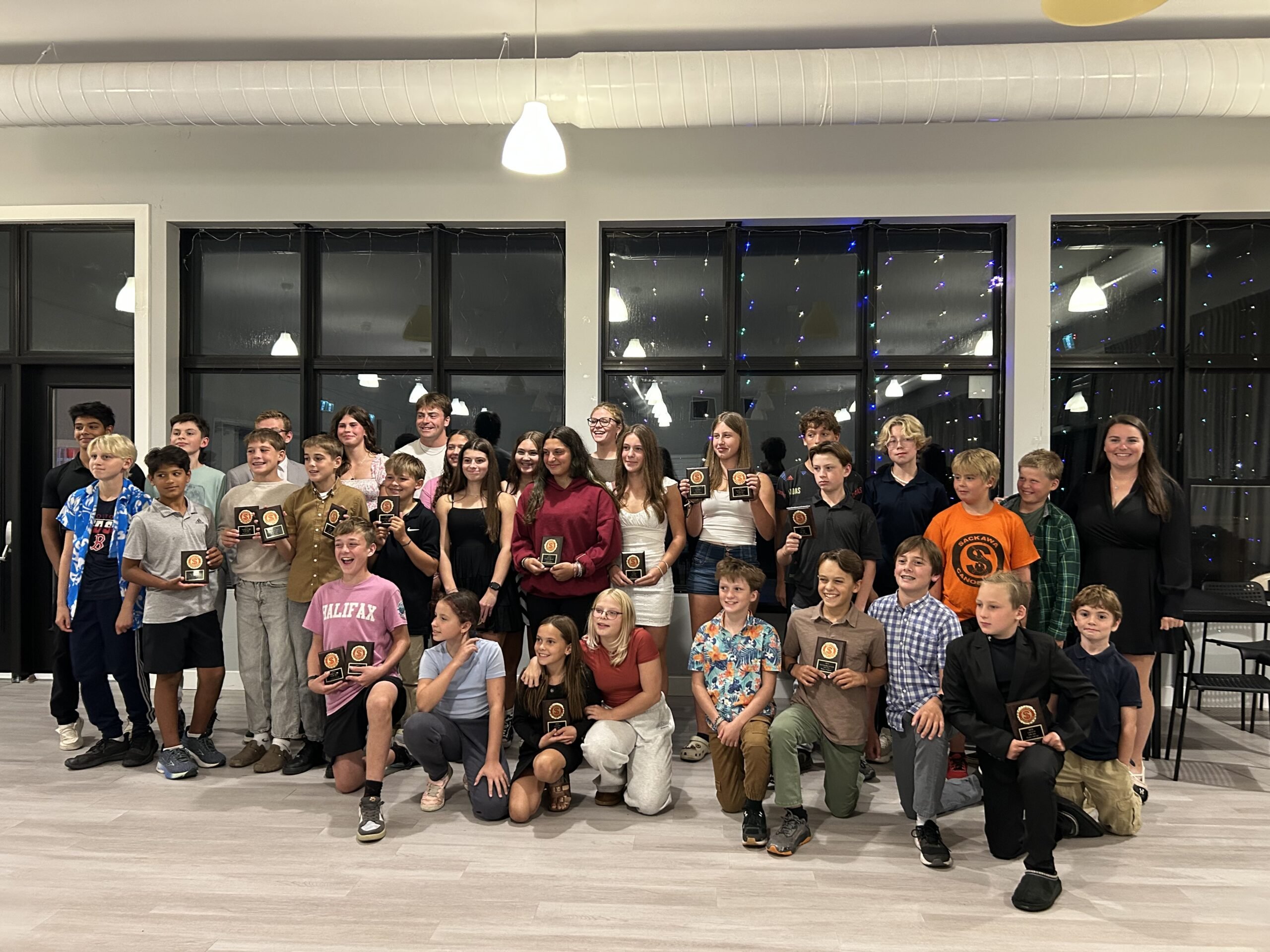 Group of youth gather for an award photo at the end of Saskawa Summer Camp