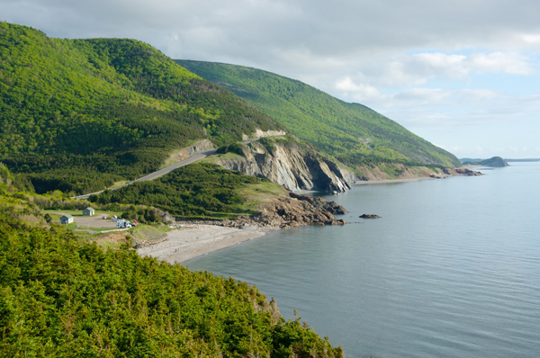 Things to Do in Nova Scotia with Kids: Panoramic views of the Cabot Trail in Cape Breton Highlands National Park from one of the many lookoffs between the communities of Cheticamp and Pleasant Bay