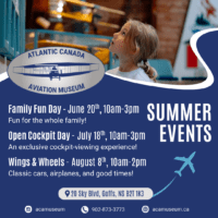 Child looking at a model airplane hanging at the Atlantic Canada Aviation Museum
