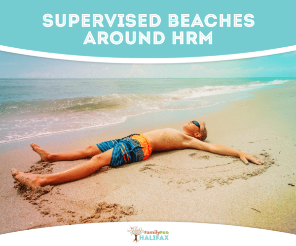 Boy laying on the sand at the beach