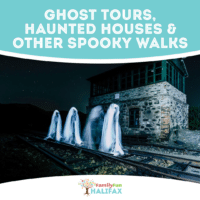 white ghosts in front of a stone building