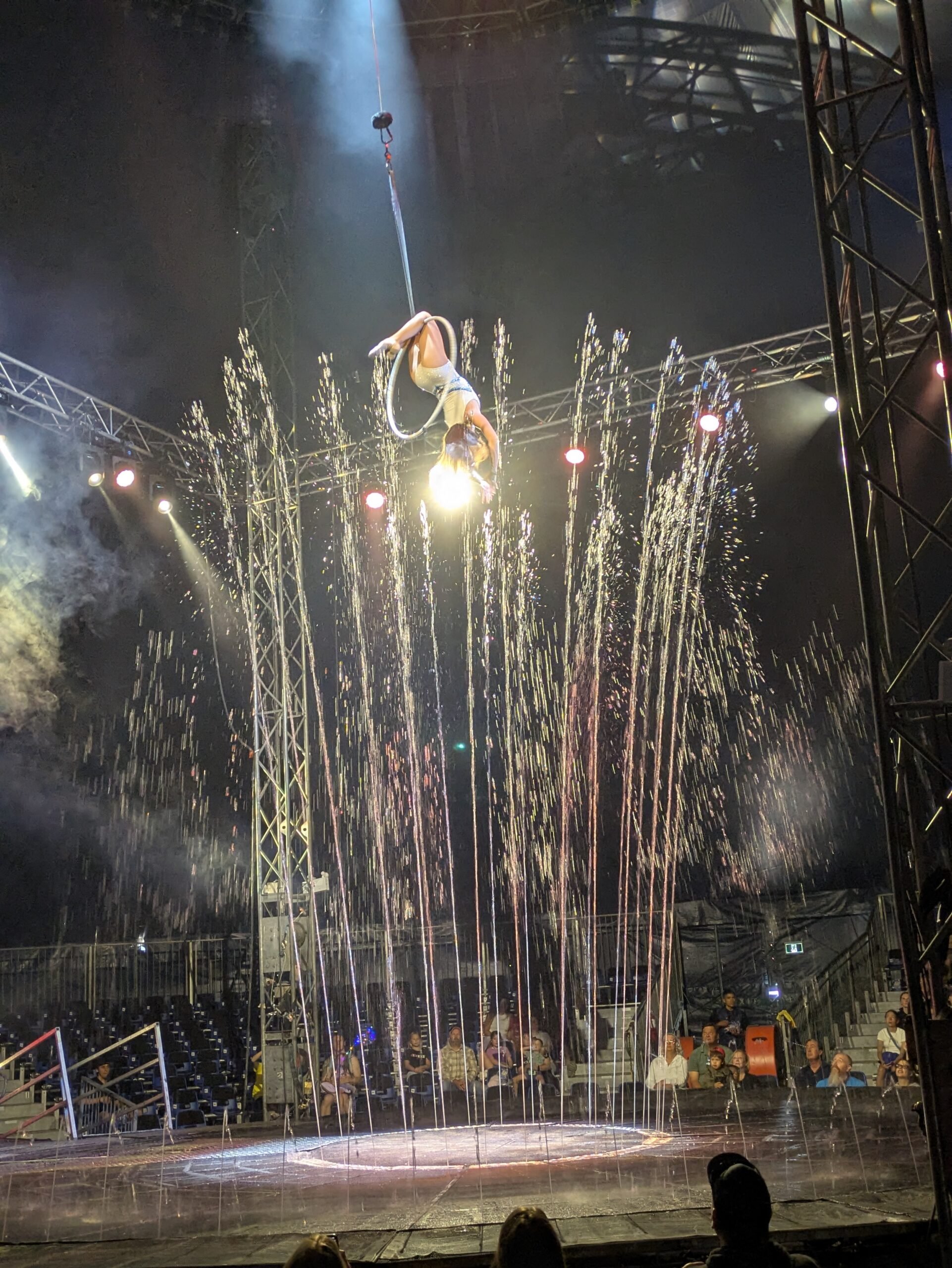 Water Circus Platinum - Performer in the air surrounded by water
