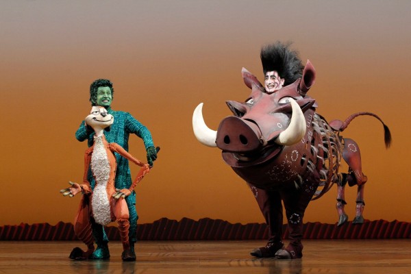 Nick Cordileone as “Timon” and Ben Lipitz as “Pumbaa” in THE LION KING National Tour. ©Disney. Photo Credit: Joan Marcus