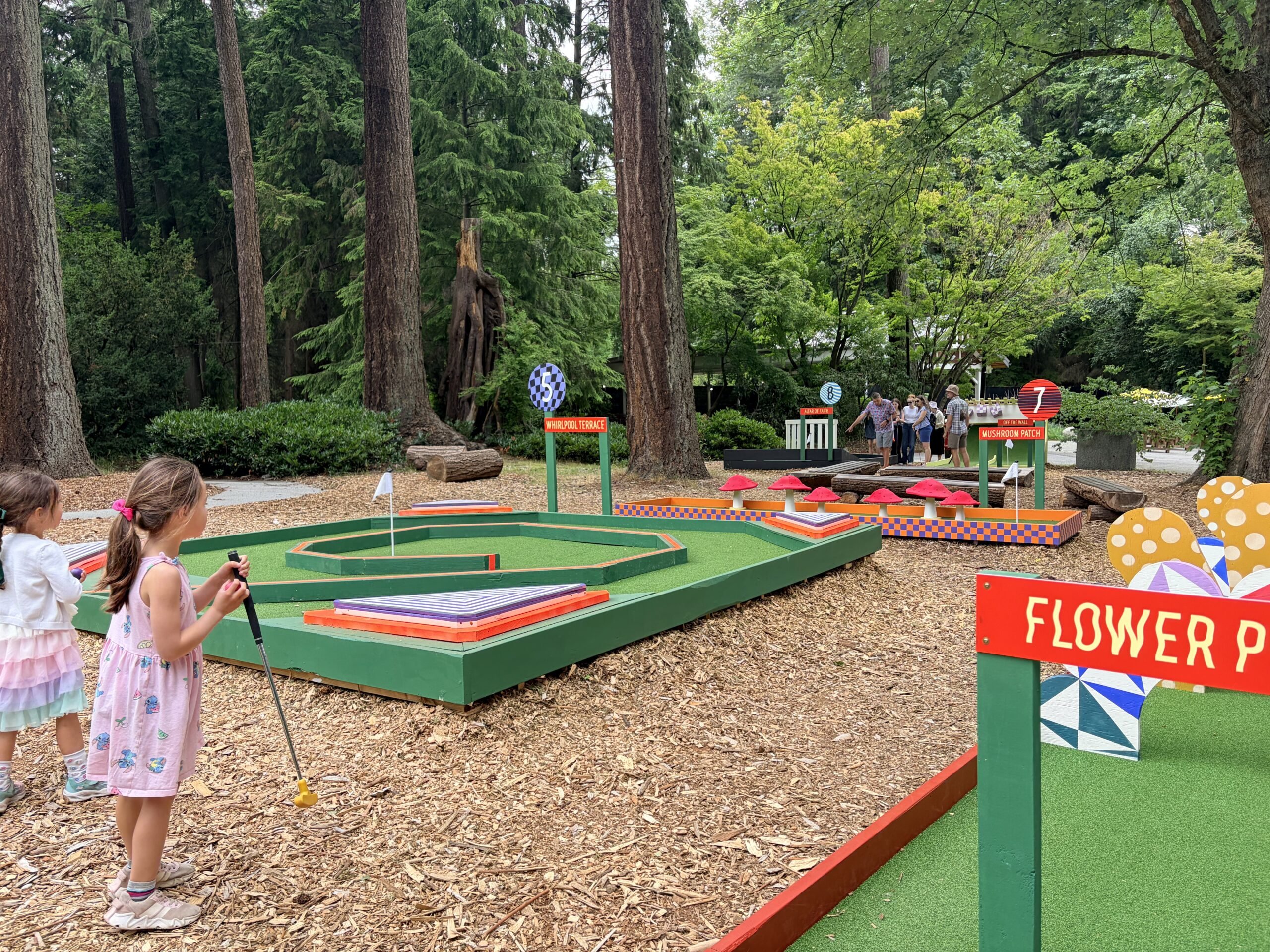 Laila putting at Stanley Park Mini Golf