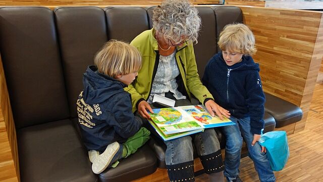 Camp Grandma - Why its important for ids to travel with grandparents - kids reading with grandma