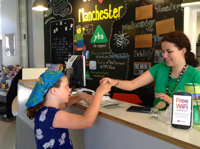 Getting our passport stamped at the friendly, modern Manchester YHA