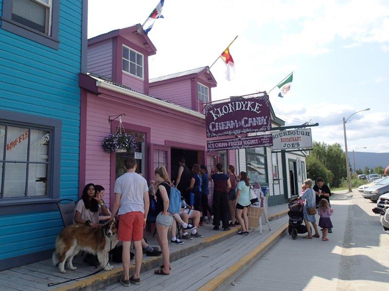 Kids parents and pups enjoying an ice cream on a blazing hot day in Dawson - photo Debra Smith