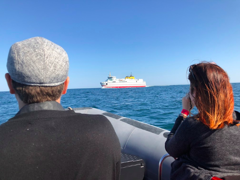 Whale watching aboard a Zodiac, with the Grand Manan ferry in the distance/photo credit: Helen Earley