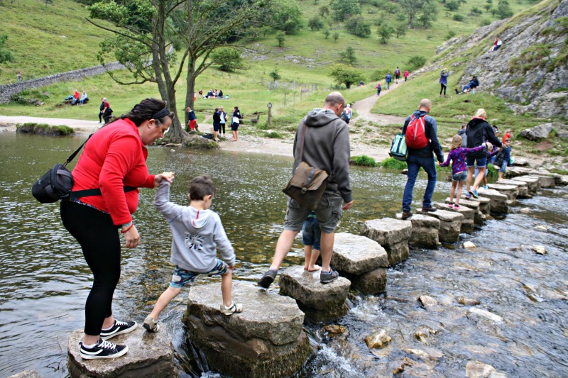 Crossing the Dovedale stepping stones with Mum, from YHA: A Family Road Trip Through England and Wales by food and travel writer Helen Earley