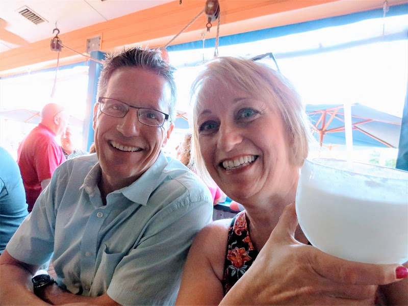 The author and her hubby are all smiles at the Conch Republic Grill in North Redington Beach where they enjoyed excellent food and a really big drink. Photo Cathy Donaldson