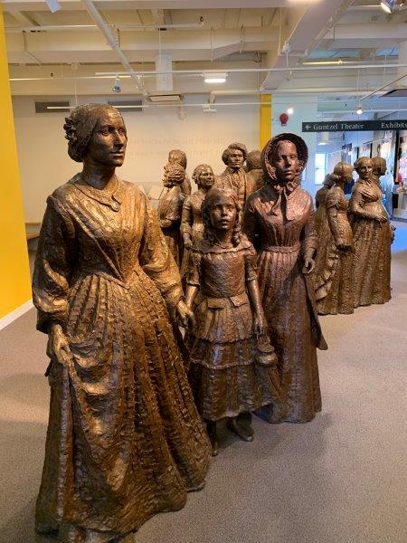 Finger Lakes Women's Rights museum statue of Elizabeth Cady Stanton and participants Photo Melody Wren