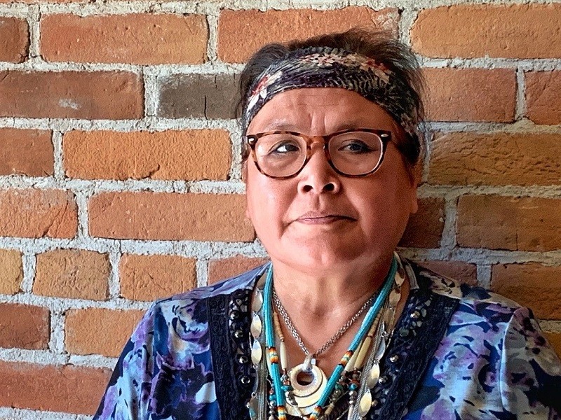 St Eugene Archivist Margaret Teneese teaches guests about residential schools - Photo Carol Patterson