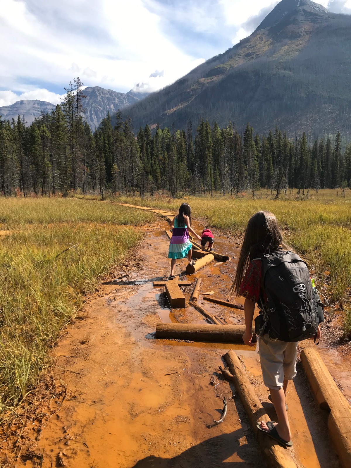 The orange trail to the Paint Pots became more vivid the closer you got to the green pools. Photo Annie Smith